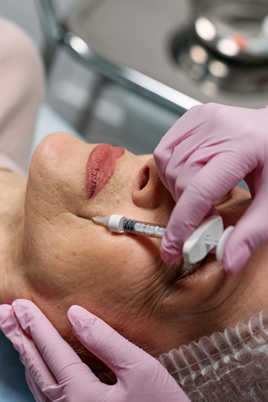 close-up-of-a-beautician-administering-a-botox-injection-to-a-woman-at-a-clinic.-7582560-scaled