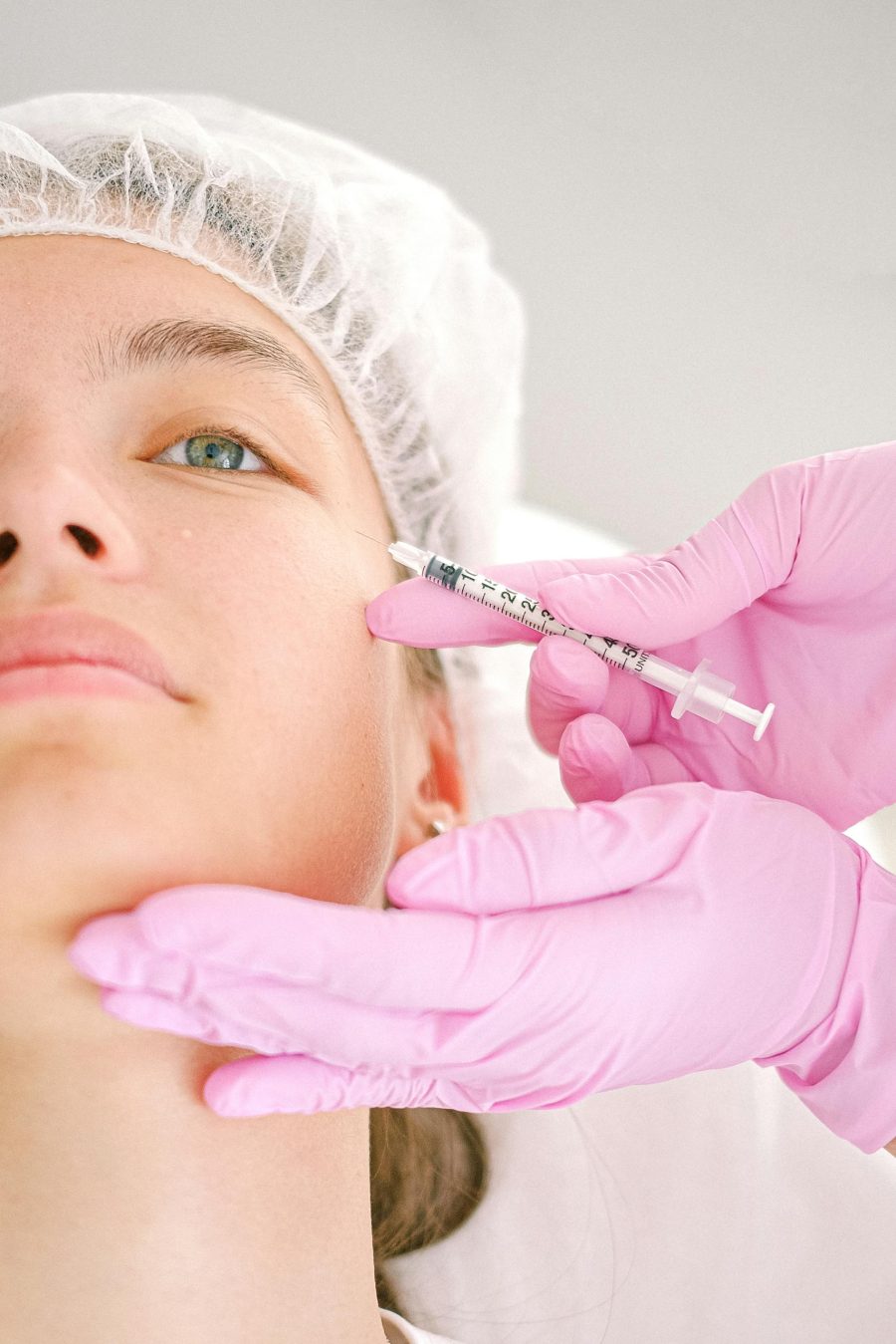 close-up-of-a-beautician-administering-facial-injection-treatment-to-a-woman-in-a-clinical-setting.-4586711-scaled